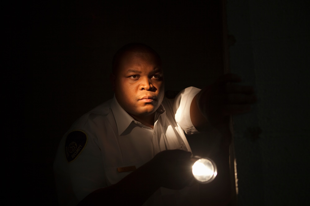 Security guard with a torch